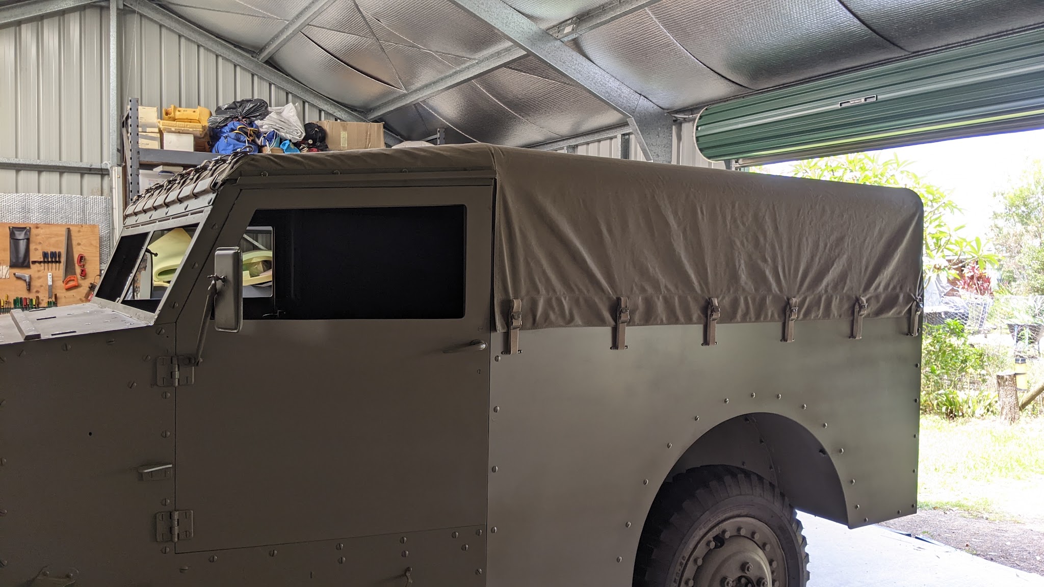 A new canvas canopy fitted to an ex military four wheel drive in the workshop