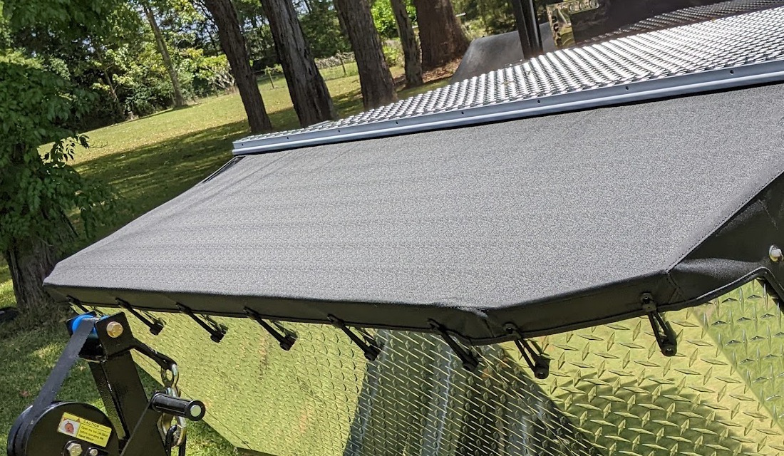 A new awning fitted along the side of an off road camper trailer
